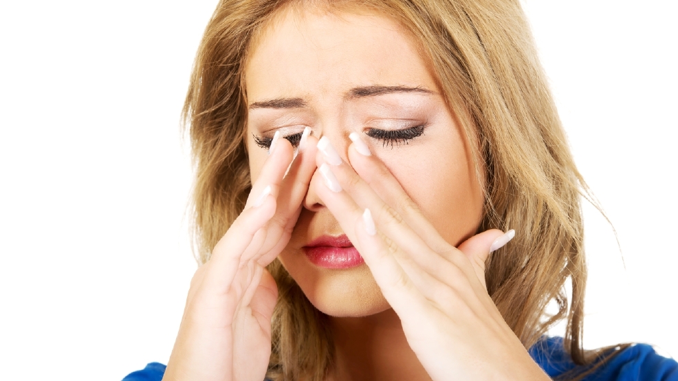 beautiful woman with sinus pressure.jpg