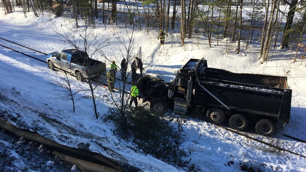 Dump truck slides off road, downhill in Woodstock WGME