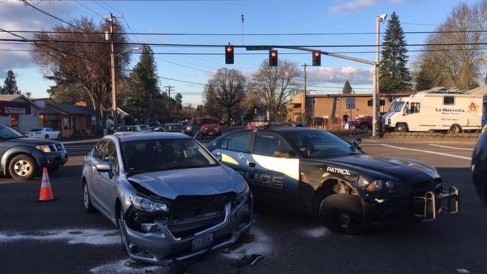 Driver collides with Beaverton Police car responding to emergency KATU